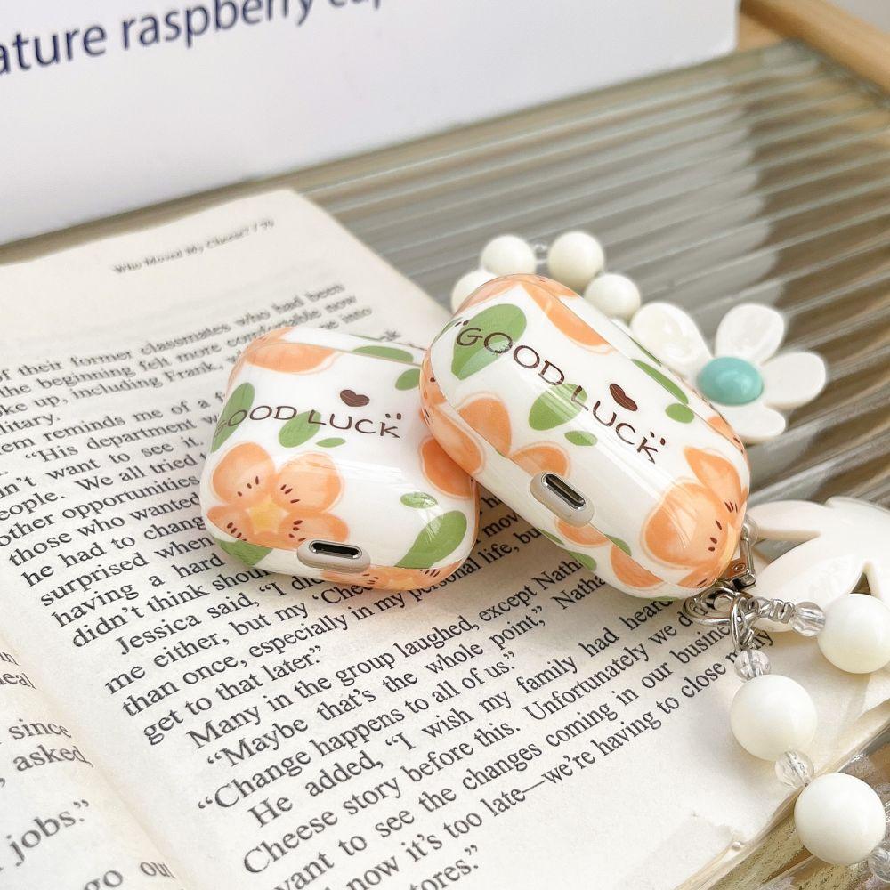 Charming Daisy Chain AirPods Case with Good Luck Charm